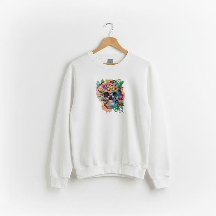 White sweatshirt with a colorful skull design on a hanger against a white background