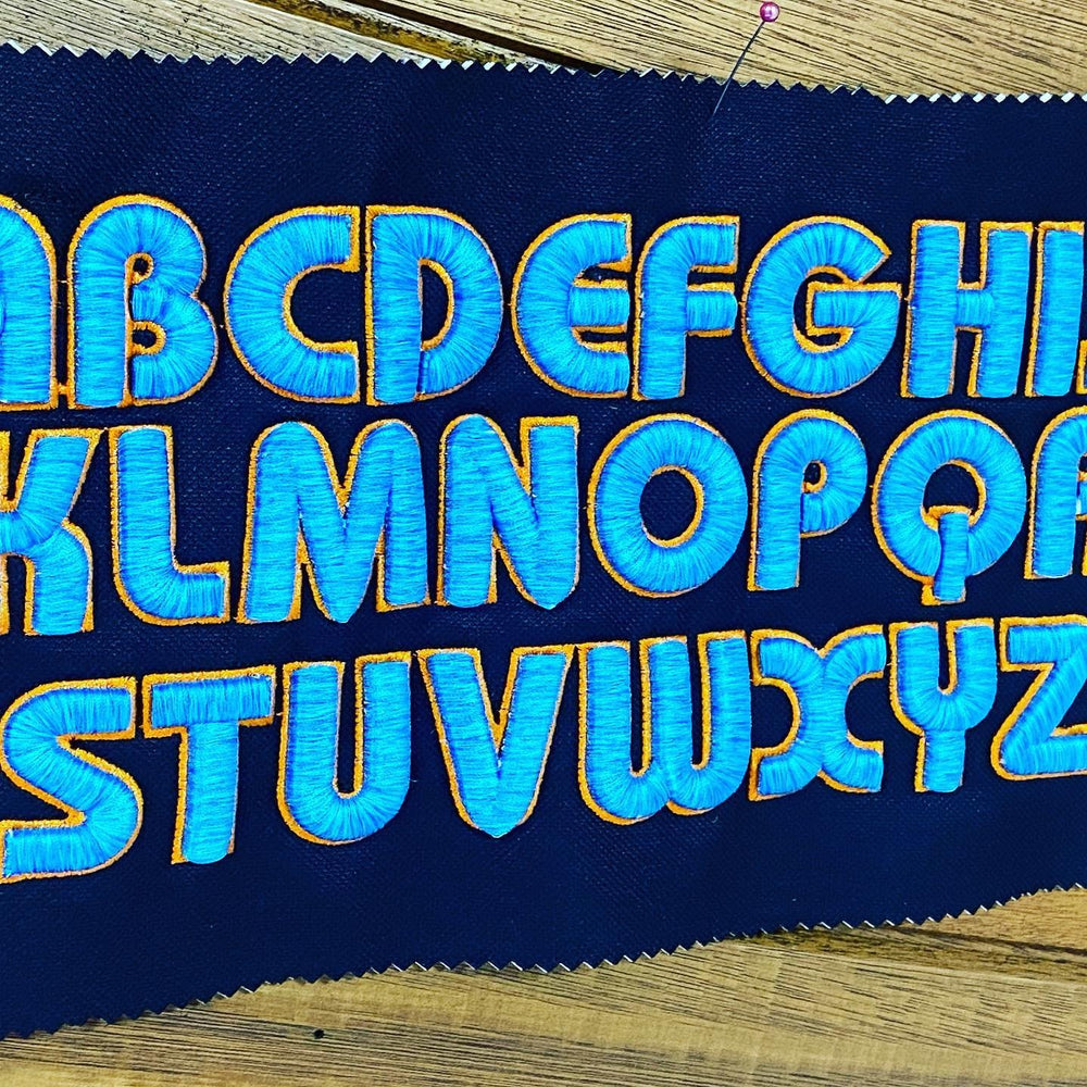 Bubble Pop 3D Puff – Full Alphabet A–Z Reference Sheet · Royal Blue fill · Gold outline · Embroidered on Navy Fabric | Hand Finished in Dubai | EmbroMania