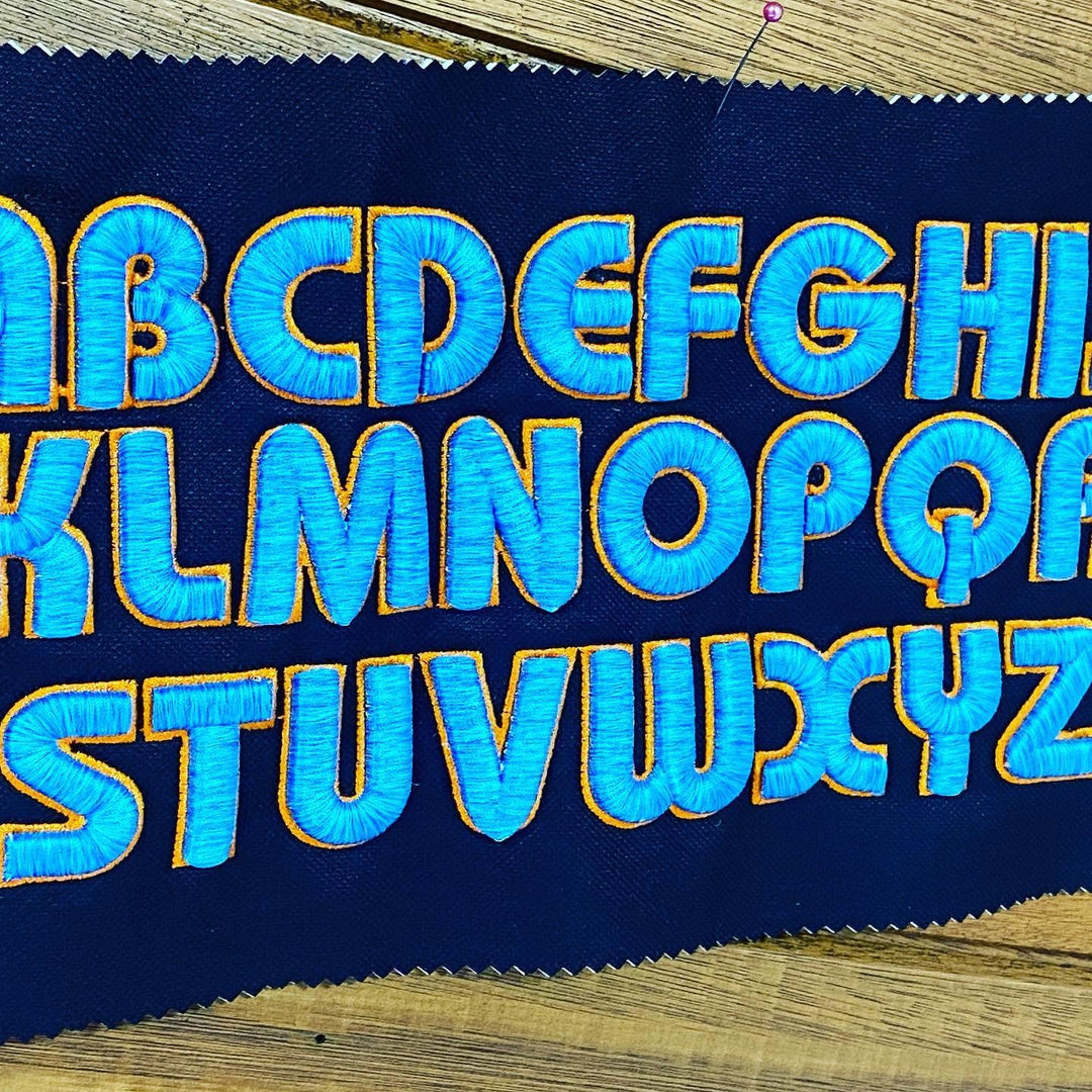 Bubble Pop 3D Puff – Full Alphabet A–Z Reference Sheet · Royal Blue fill · Gold outline · Embroidered on Navy Fabric | Hand Finished in Dubai | EmbroMania