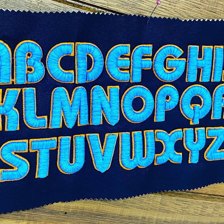 Bubble Pop 3D Puff – Full Alphabet A–Z Reference Sheet · Royal Blue fill · Gold outline · Embroidered on Navy Fabric | Hand Finished in Dubai | EmbroMania