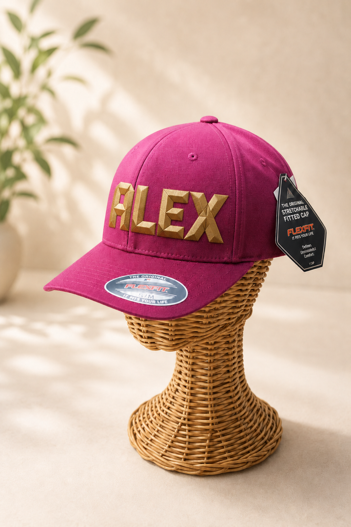 DiamondCut geometric faceted embroidery spelling ALEX in Heritage Cut — burgundy snapback with gold 3D puff