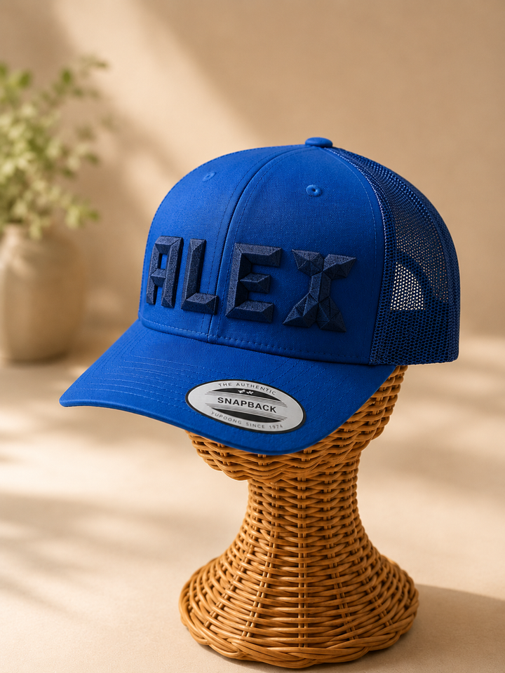 DiamondCut geometric faceted embroidery spelling ALEX in Ocean Depth — bright blue snapback with navy 3D puff