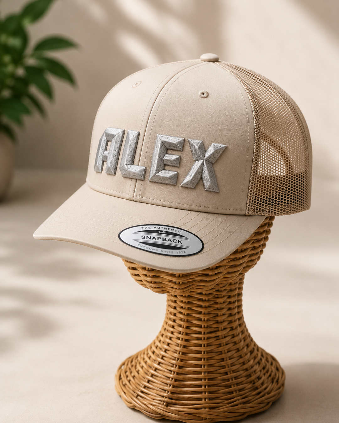 DiamondCut geometric faceted embroidery spelling ALEX in Precision Facet — beige/cream trucker cap with mesh back and silver 3D puff
