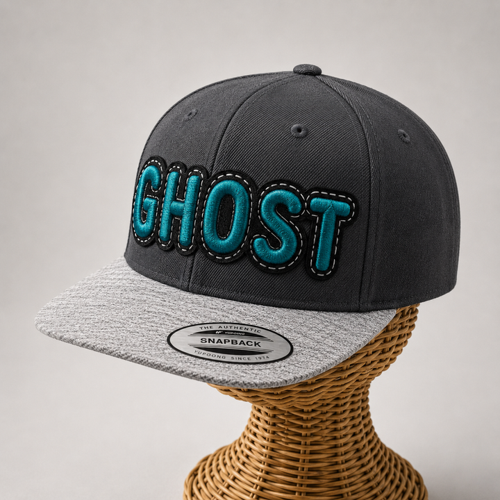 Phantom Pop – DoubleLayer Pop · Teal letter · Black border · Charcoal heather grey snapback | Hand Finished in Dubai | EmbroMania