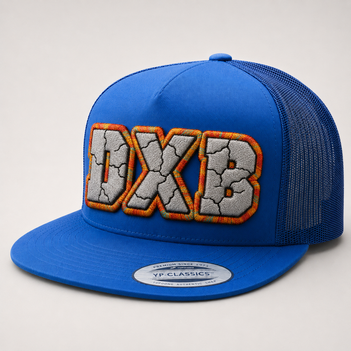 🔥 Ember Frost – Cracked 3D Puff · Light grey fill · Orange red amber gold teal outline · All royal blue flat trucker | Hand Finished in Dubai | EmbroMania