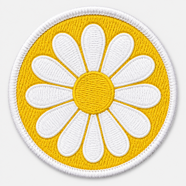 Meadow Daisy embroidery patch featuring a daisy flower facing forward in flat white and yellow | Hand Finished in Dubai | EmbroMania