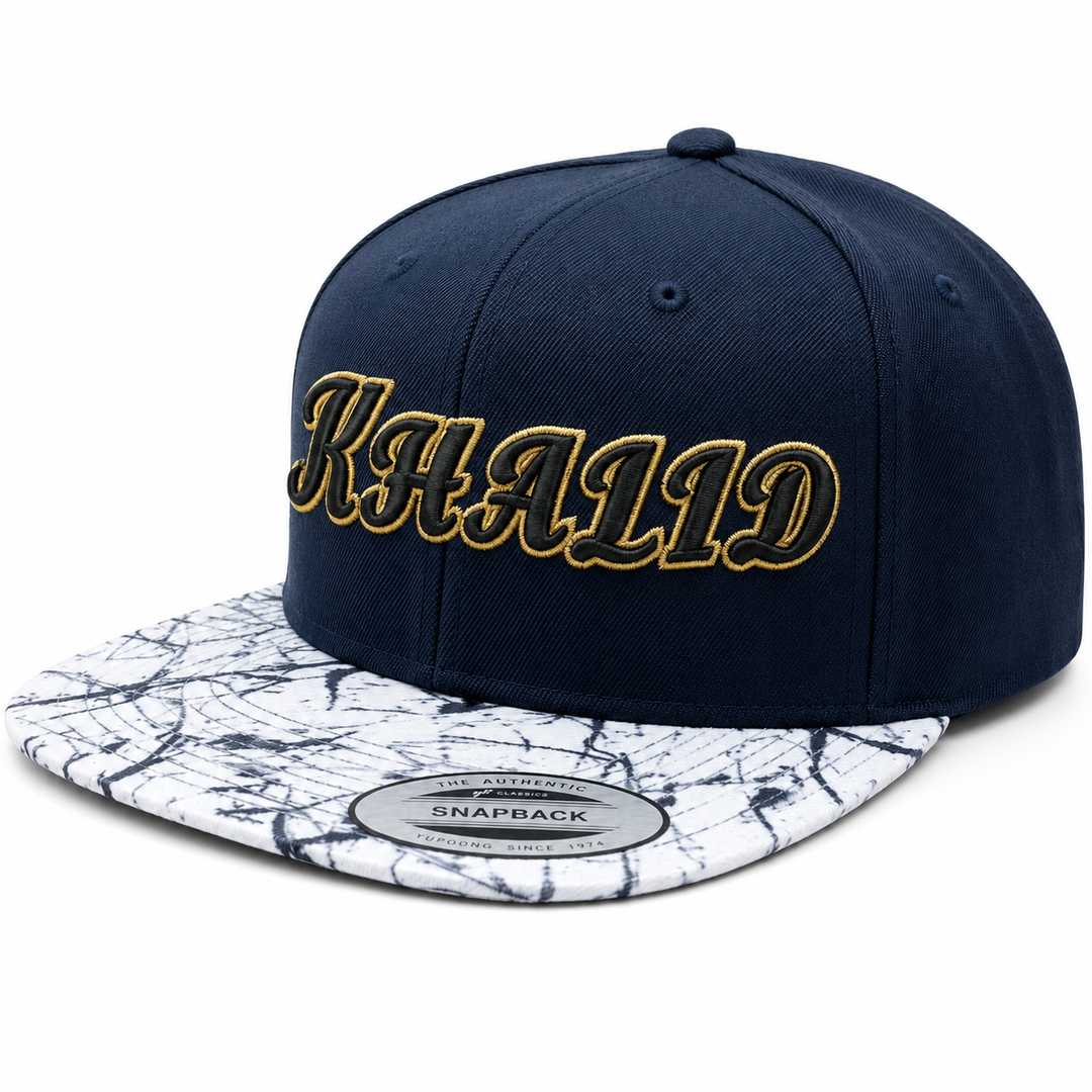 ⚫🟡 Dark Sovereign – Monarch Script 3D Puff · Black fill · Gold outline · Navy Marble Snapback | Hand Finished in Dubai | EmbroMania