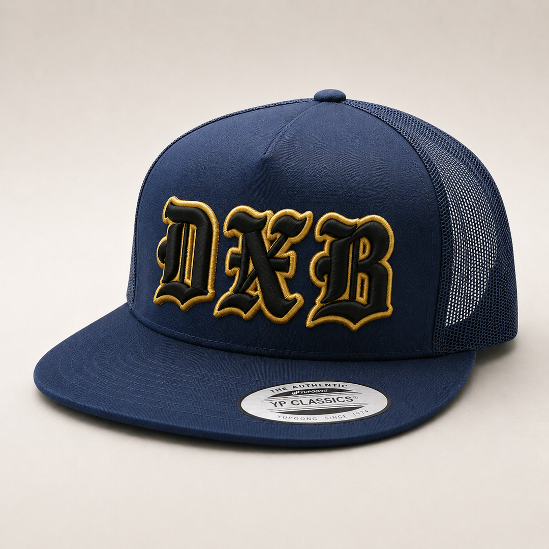 ⭐ Black Gold – Old English 3D Puff · Black fill · Gold puff outline · Dark navy flat trucker | Hand Finished in Dubai | EmbroMania