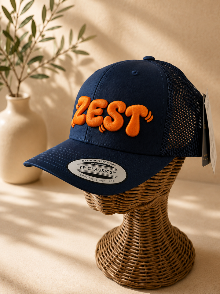 Tangerine – PlayPop 3D Puff · Bright orange bubble letters · Dark navy curved trucker | Hand Finished in Dubai | EmbroMania