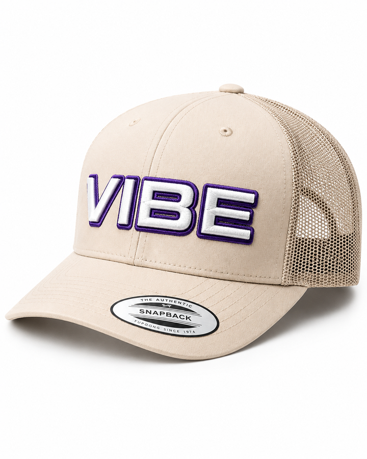 SquadOutline two-layer 3D puff embroidery spelling VIBE in Creative Edge — beige cap with rich purple outline and clean white puff fill