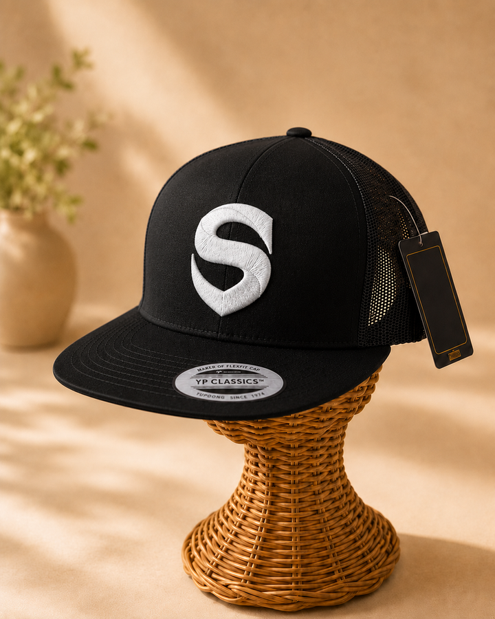 🖤⚡ Iron Shield – Stitched Shield · White 3D puff · Black Flat Trucker | Hand Finished in Dubai | EmbroMania