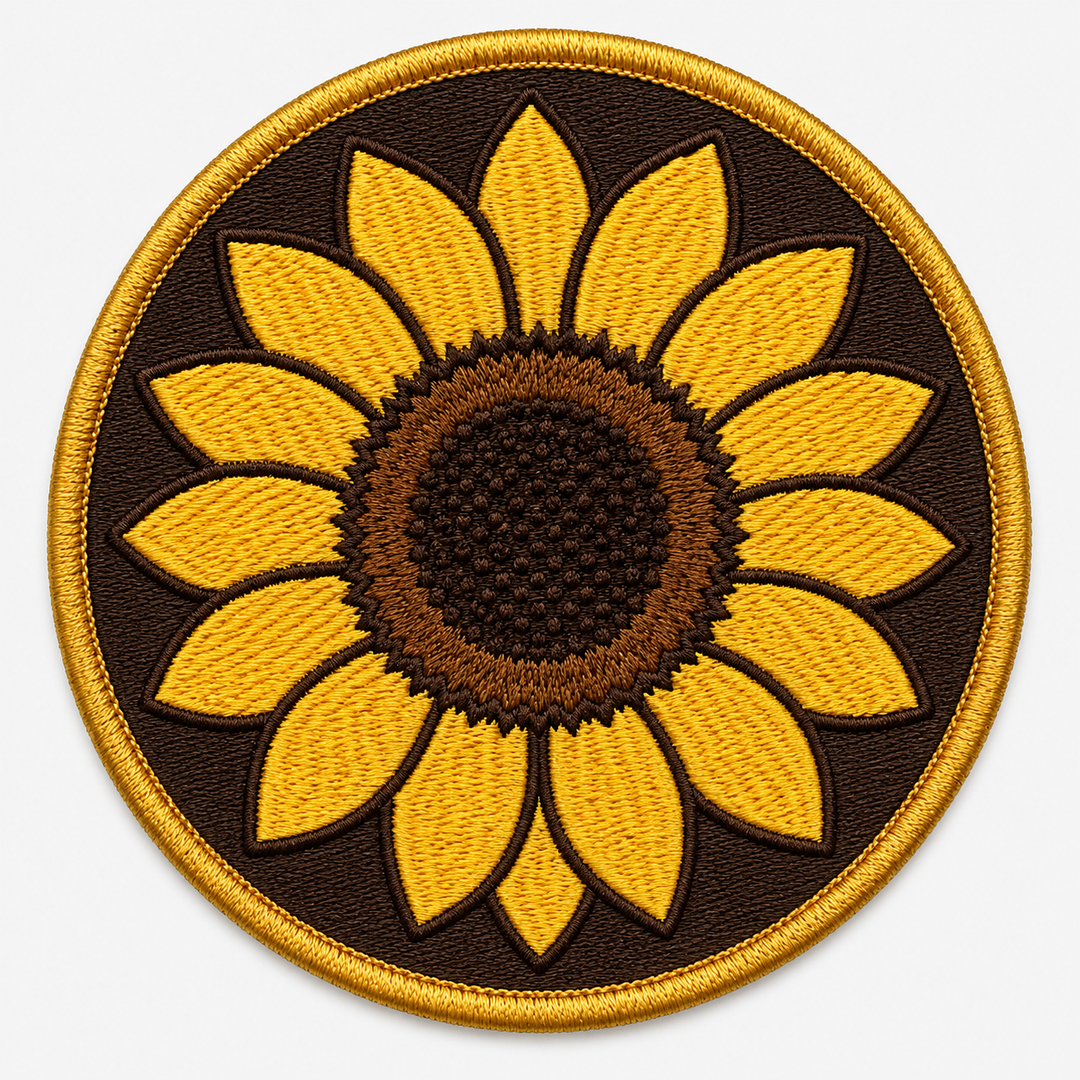 Sunfield Crest embroidery patch featuring a sunflower head facing forward in flat yellow and brown | Hand Finished in Dubai | EmbroMania